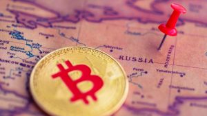 Een Afbeelding Van Een Bitcoin BTC Munt Naast Een Pin Op Het Land Rusland E1763915532768.jpg
